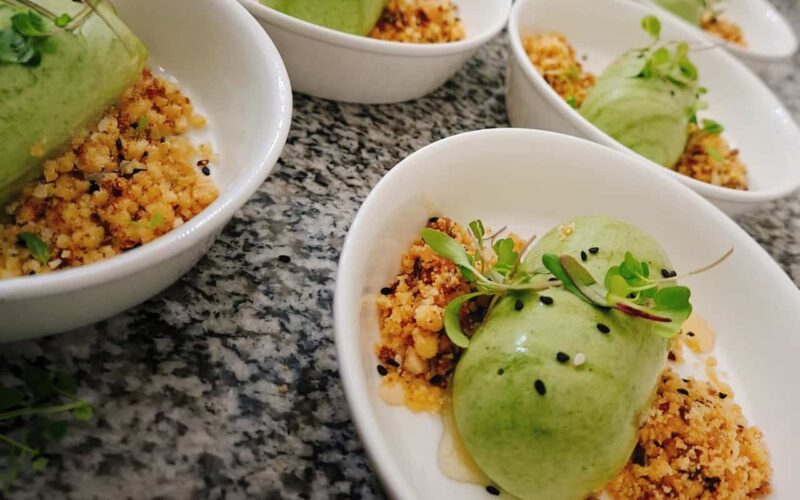 Elegant dessert served at Welgelegen Manor Delicious green mousse dessert with crunchy topping in white bowls at Welgelegen Manor.
