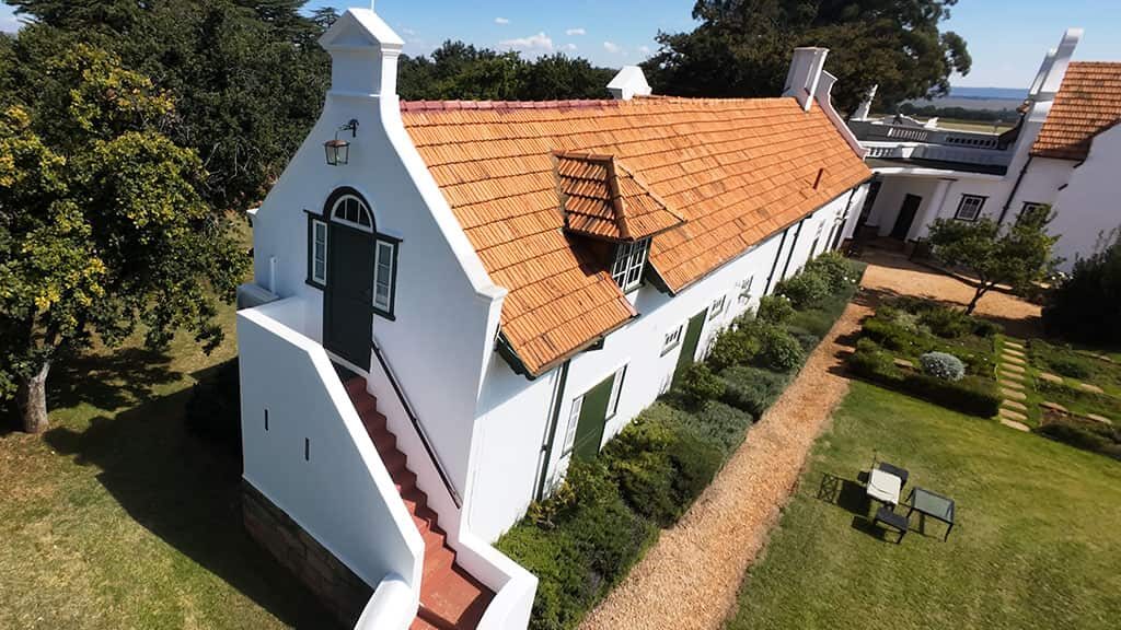 Historic Cape Dutch-style manor house at Welgelegen Manor estate, South Africa. Welgelegen Manor, Cape Dutch architecture, historic estate, South Africa.
